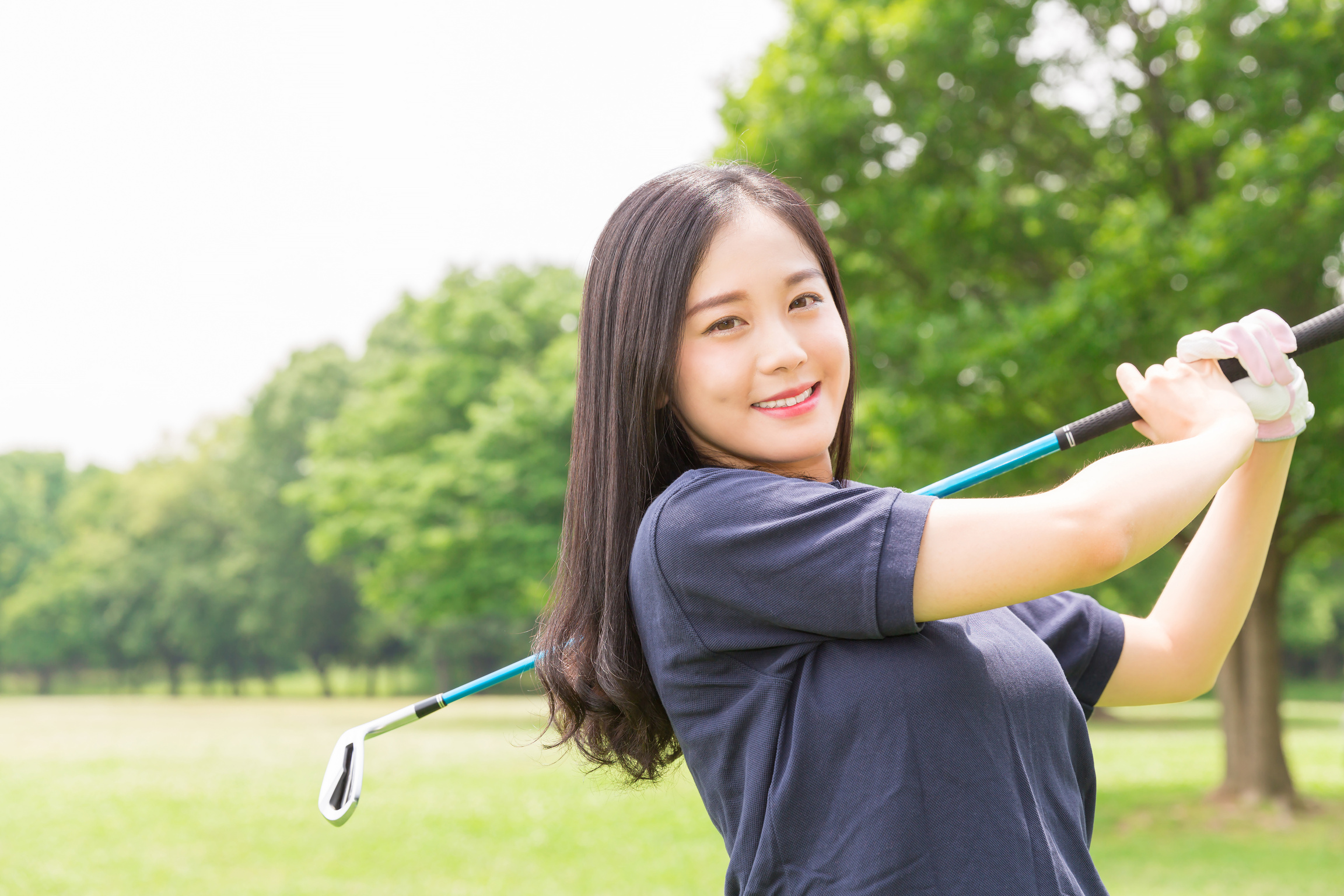 Japanese woman playing golf