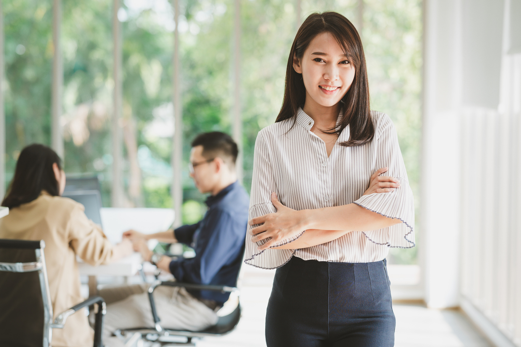 Asian Businesswoman Standing in Office